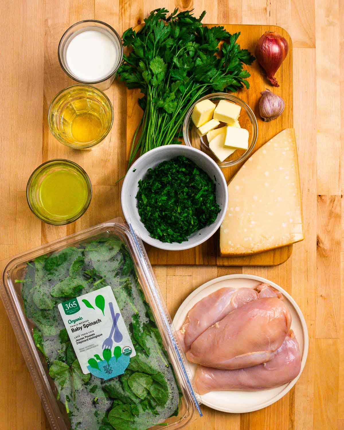 Ingredients shown: heavy cream, wine, chicken stock, parsley, spinach, butter, shallot, garlic, Parmigiano Reggiano, and chicken.