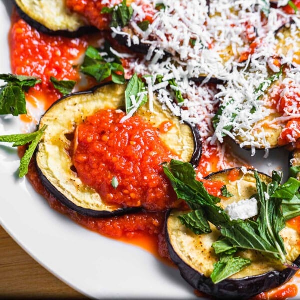 Roasted eggplant with sauce, mint, and ricotta salata featured image.