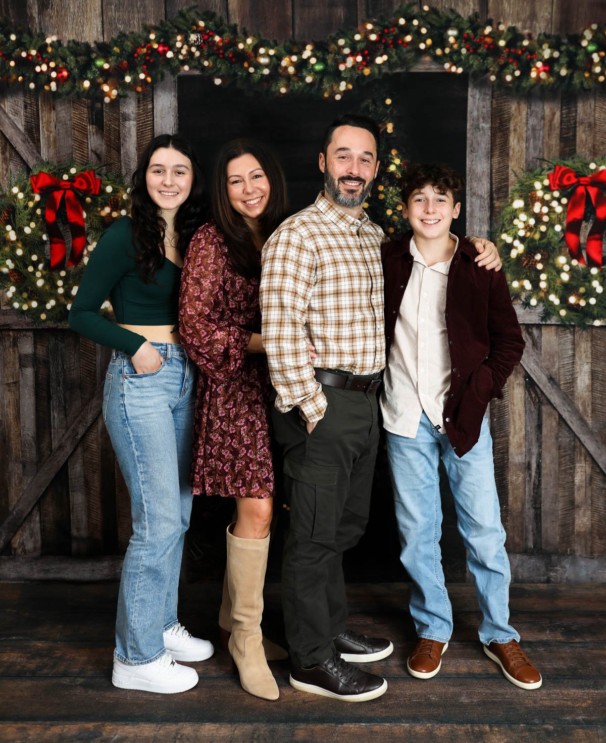 Sip and Feast family pic with Christmas background.