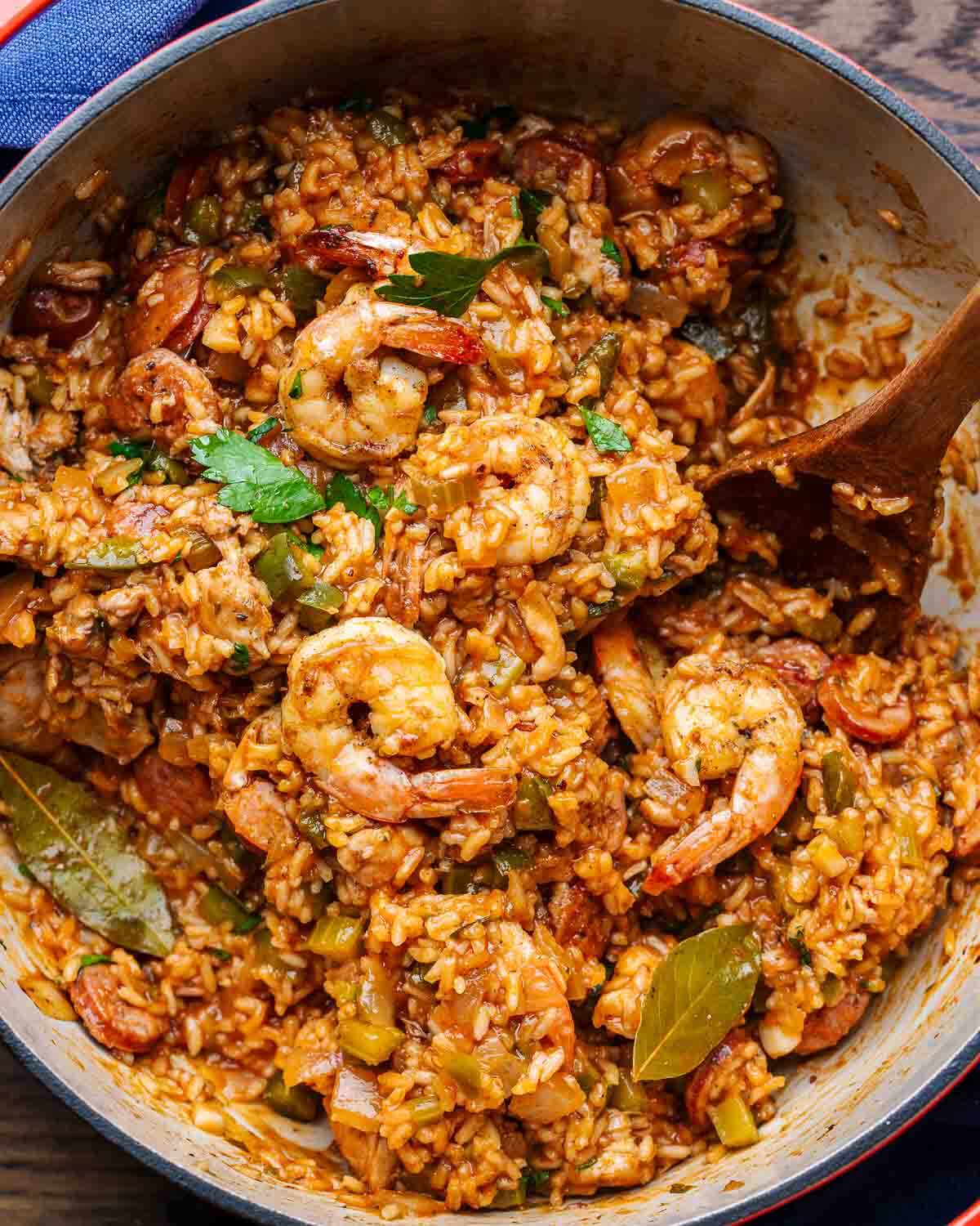 Pot of jambalaya with shrimp on top.