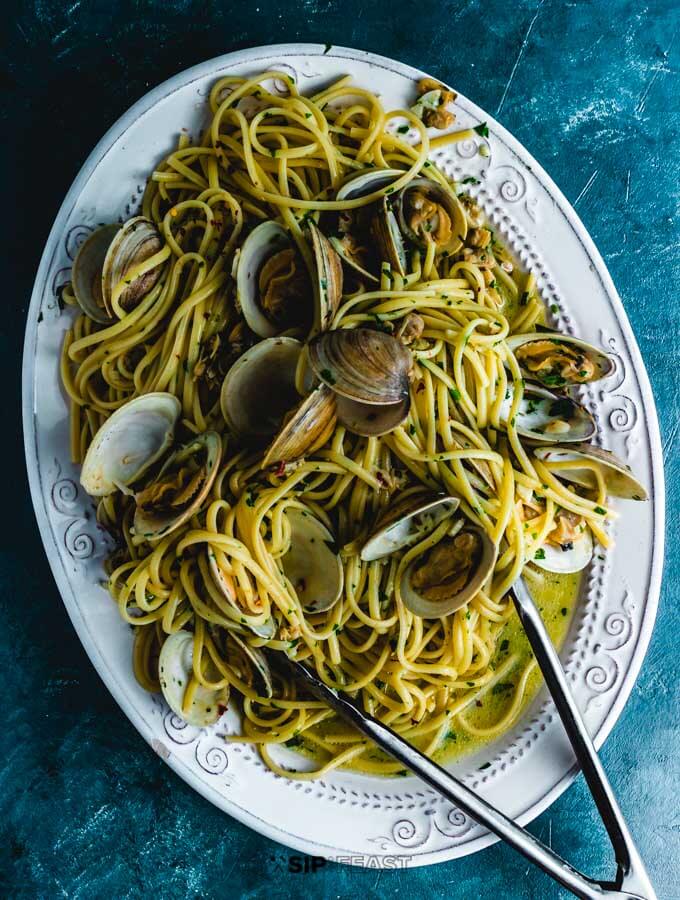 Linguine alle vongole plated in large platter.