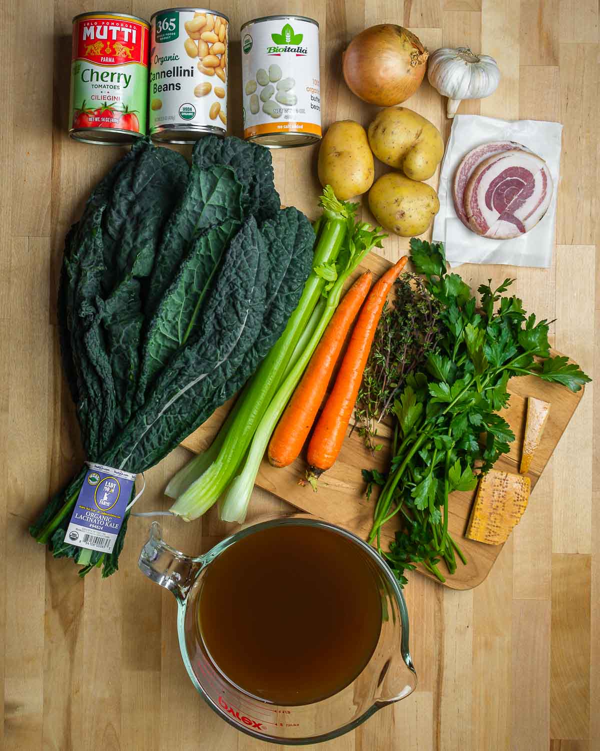 Ingredients shown: tomatoes, beans, onion, garlic, potatoes, pancetta, kale, celery, carrota, herbs, parmesan rinds, and vegetable stock.