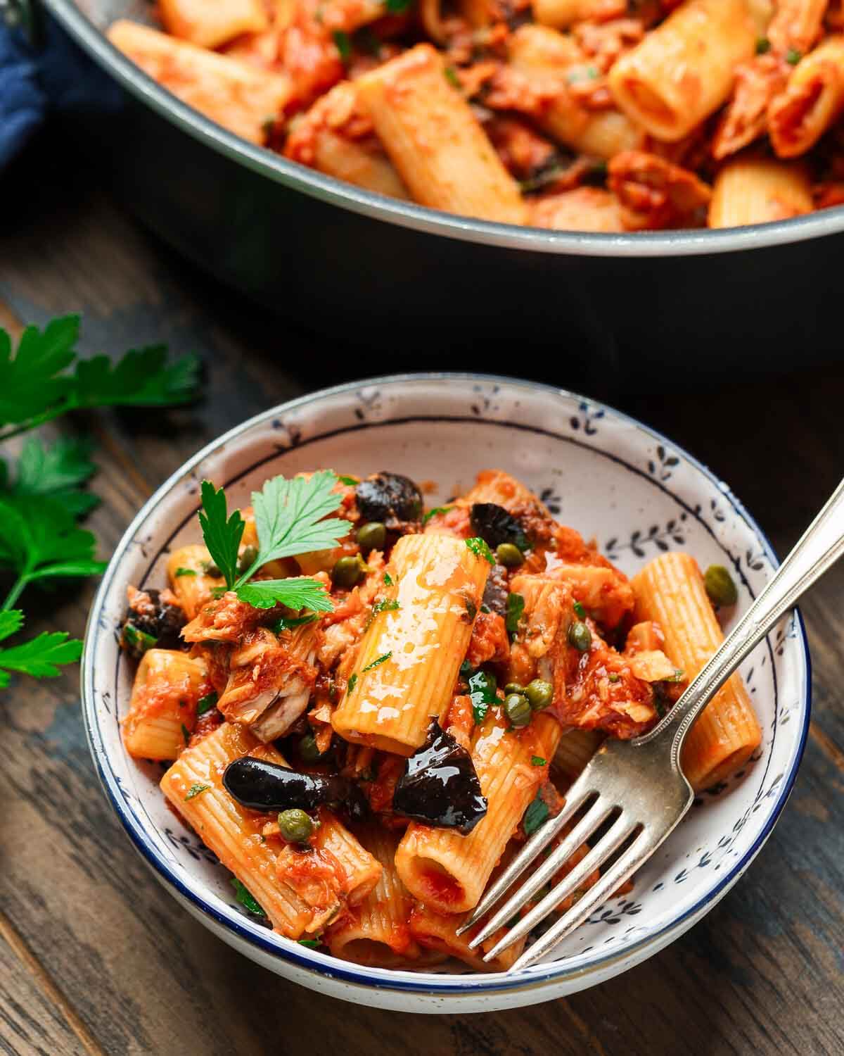 Pasta al tonno in white bowl.