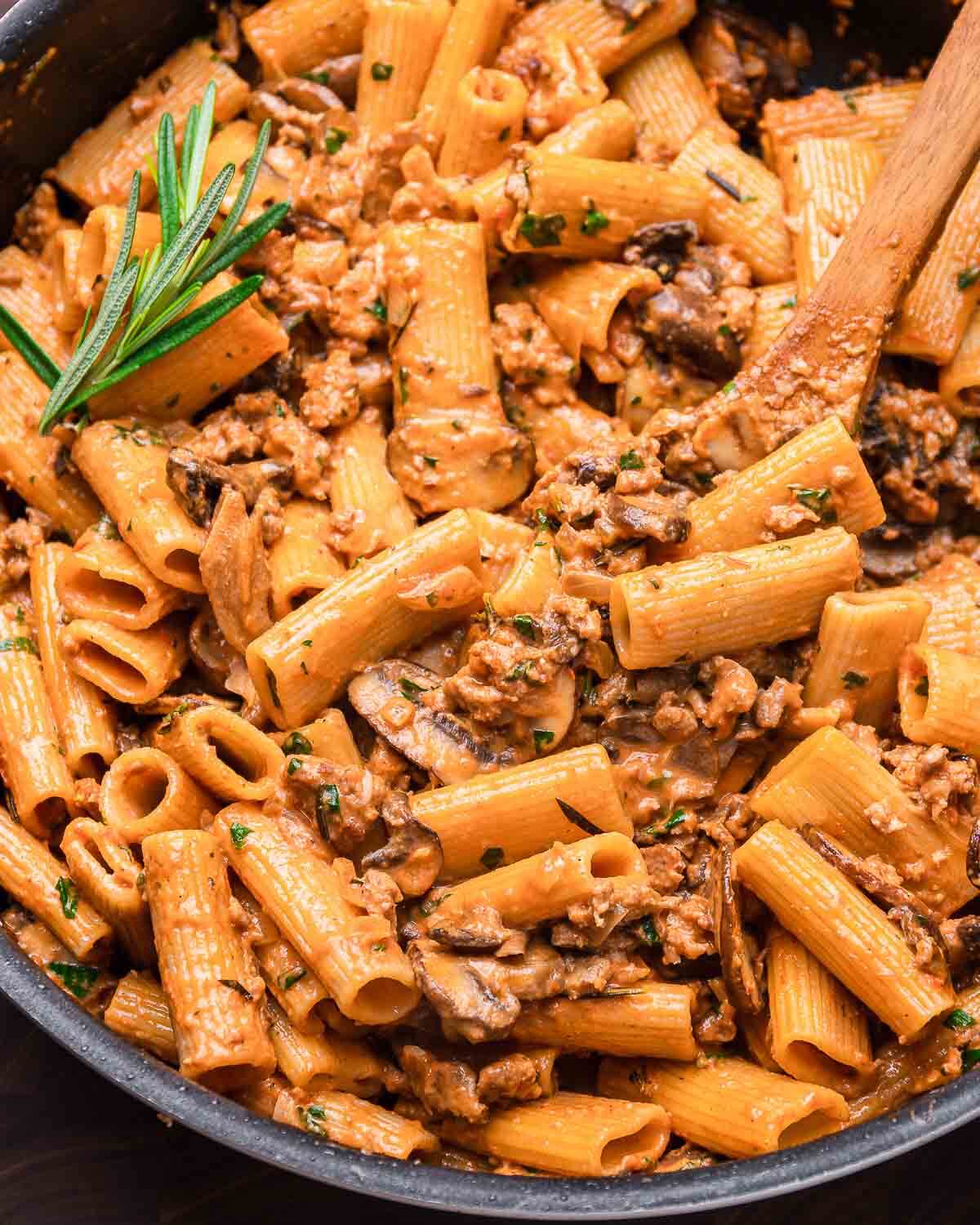 Pasta alla boscaiola in large black pan.