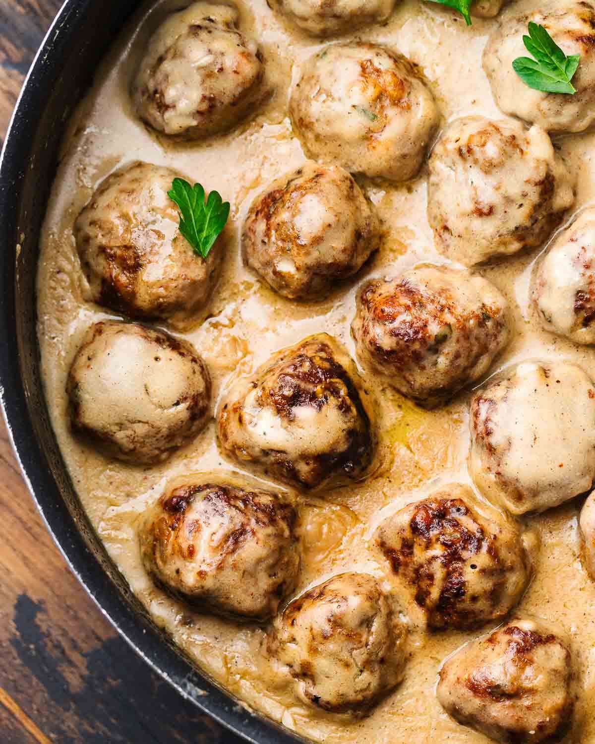 Swedish meatballs in black pan.